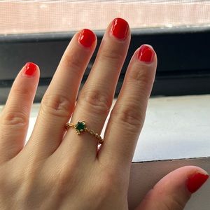 14k white gold with green stone